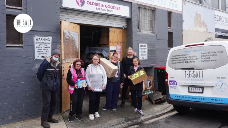 a group of SALT Foundation participants in an alley with the SALT van